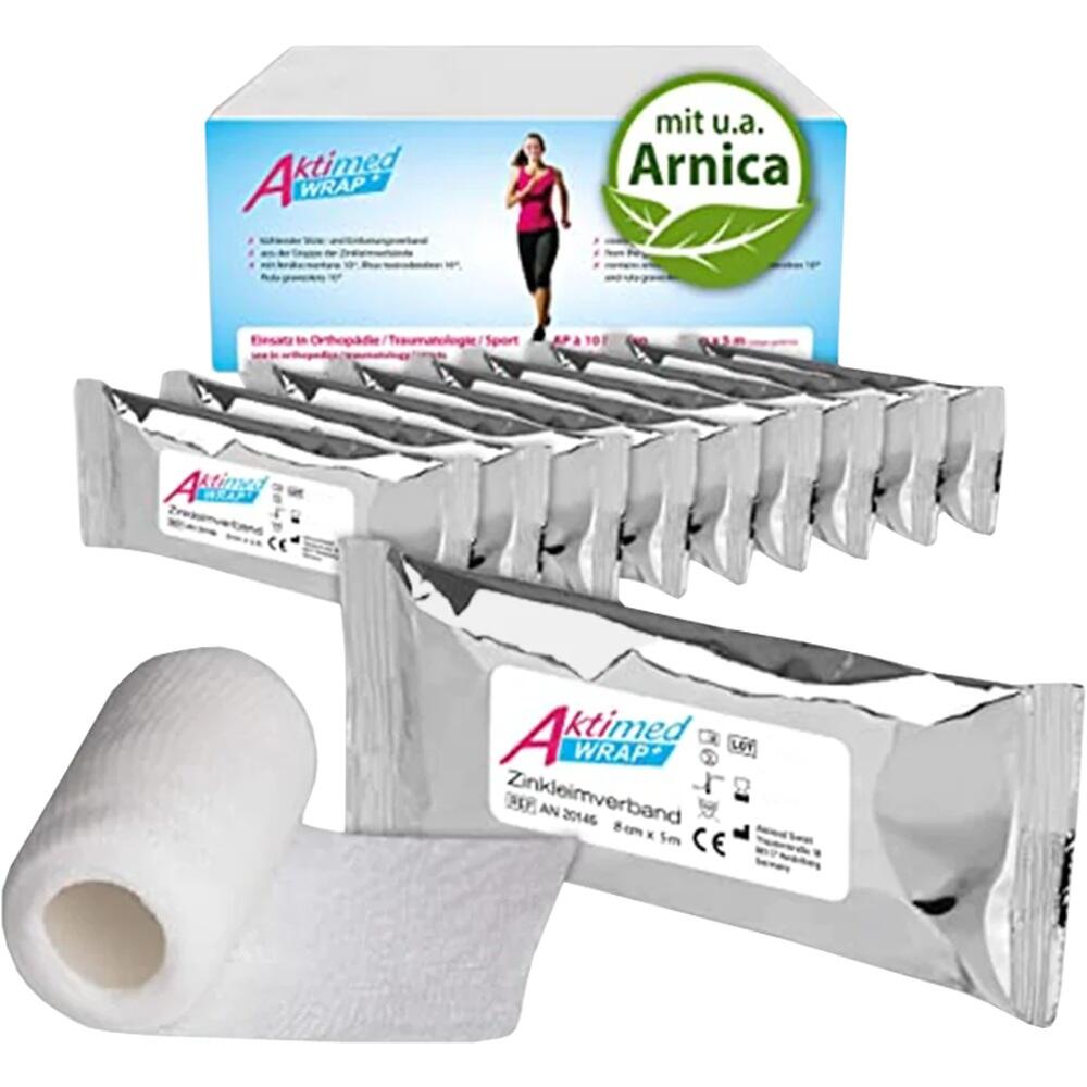 Eine Box und mehrere Packungen Zinkverband mit einer Rolle auf einem Tisch.