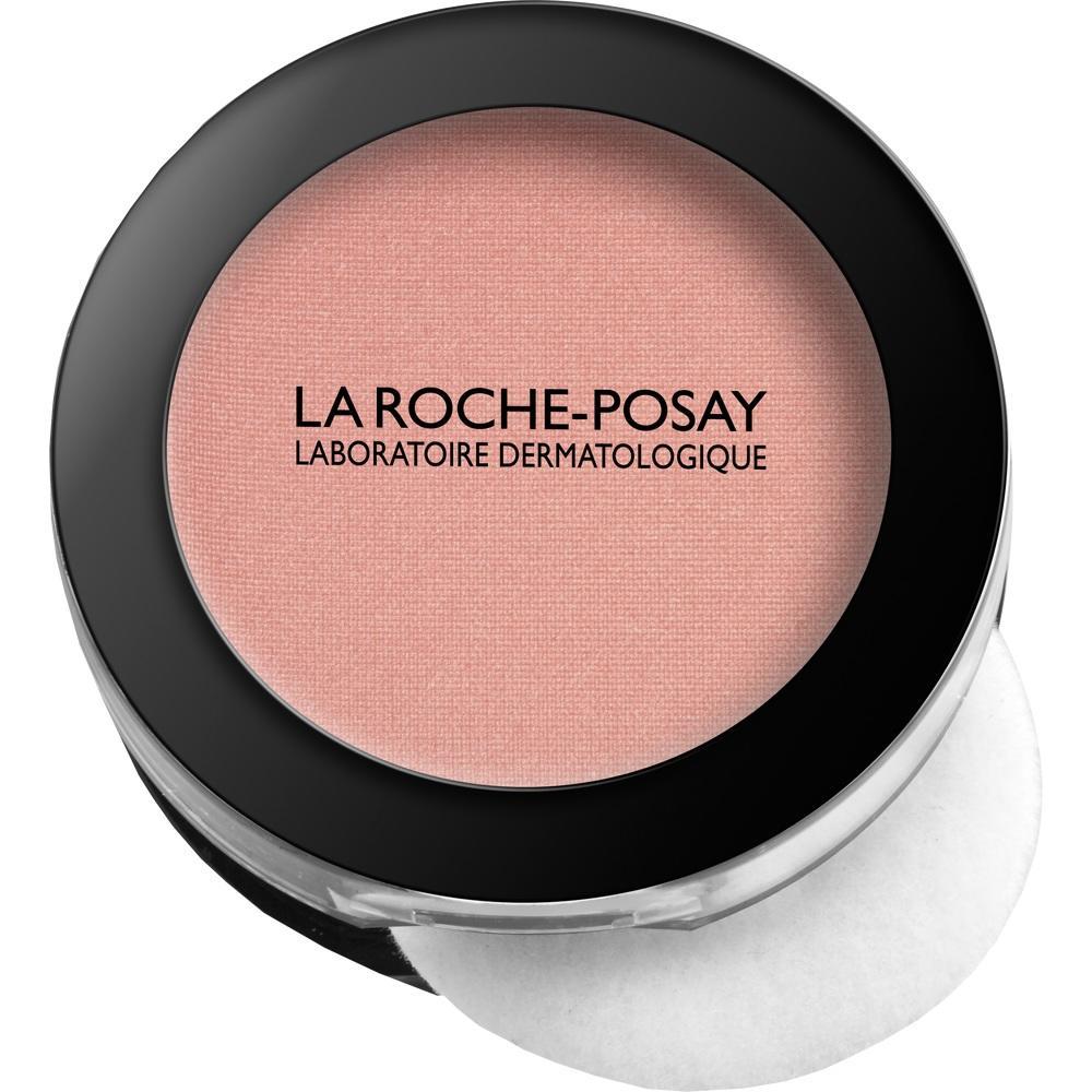 Rundes Make-up in rosa mit schwarzem Rand und Schriftzug &bdquo;La Roche-Posay&ldquo;.