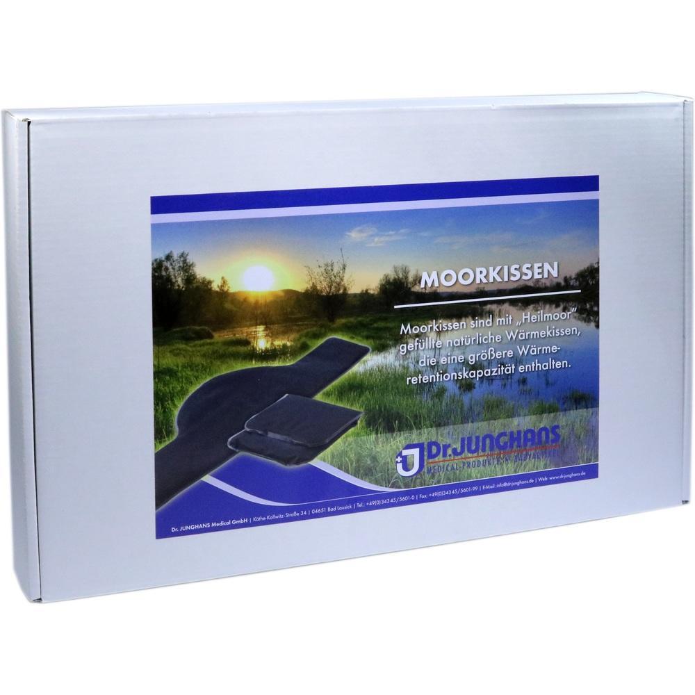 Eine Verpackung mit Moorkissen, vor einem Bild von Sonnenuntergang über einer Wiese.