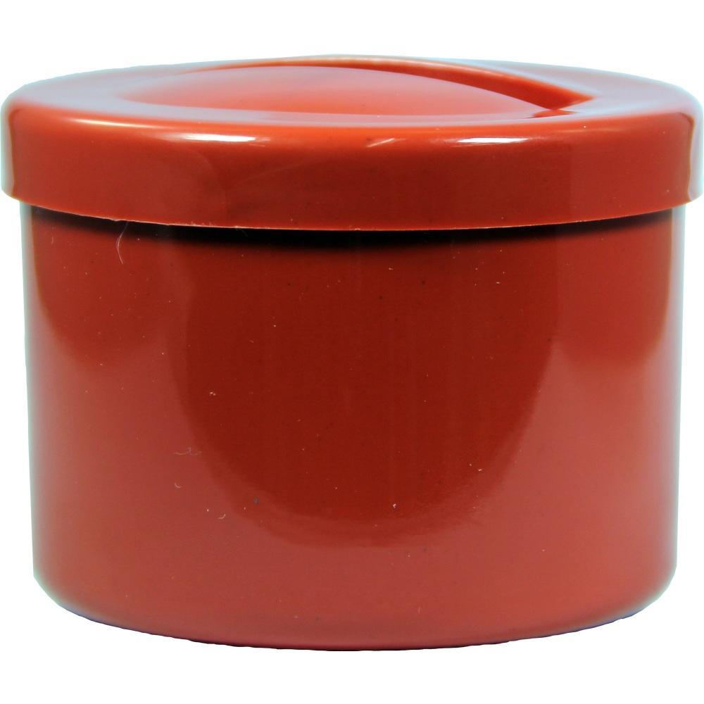 Runde, rote Dose mit Deckel.