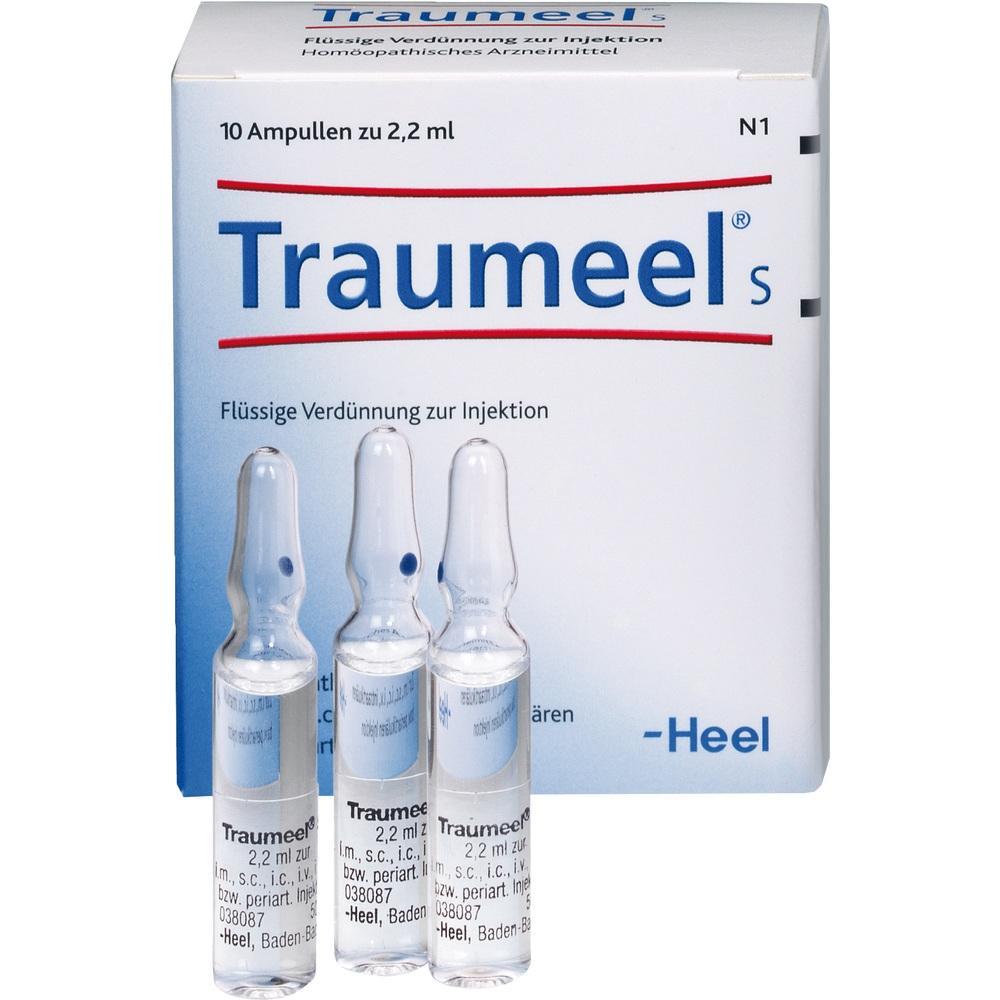 Eine Packung mit dem homöopathischen Medikament Traumeel und drei Ampullen davor.
