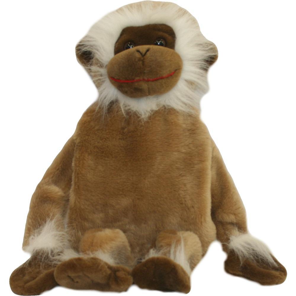 Ein brauner Stoffaffe mit weißem Gesicht sitzt aufrecht.