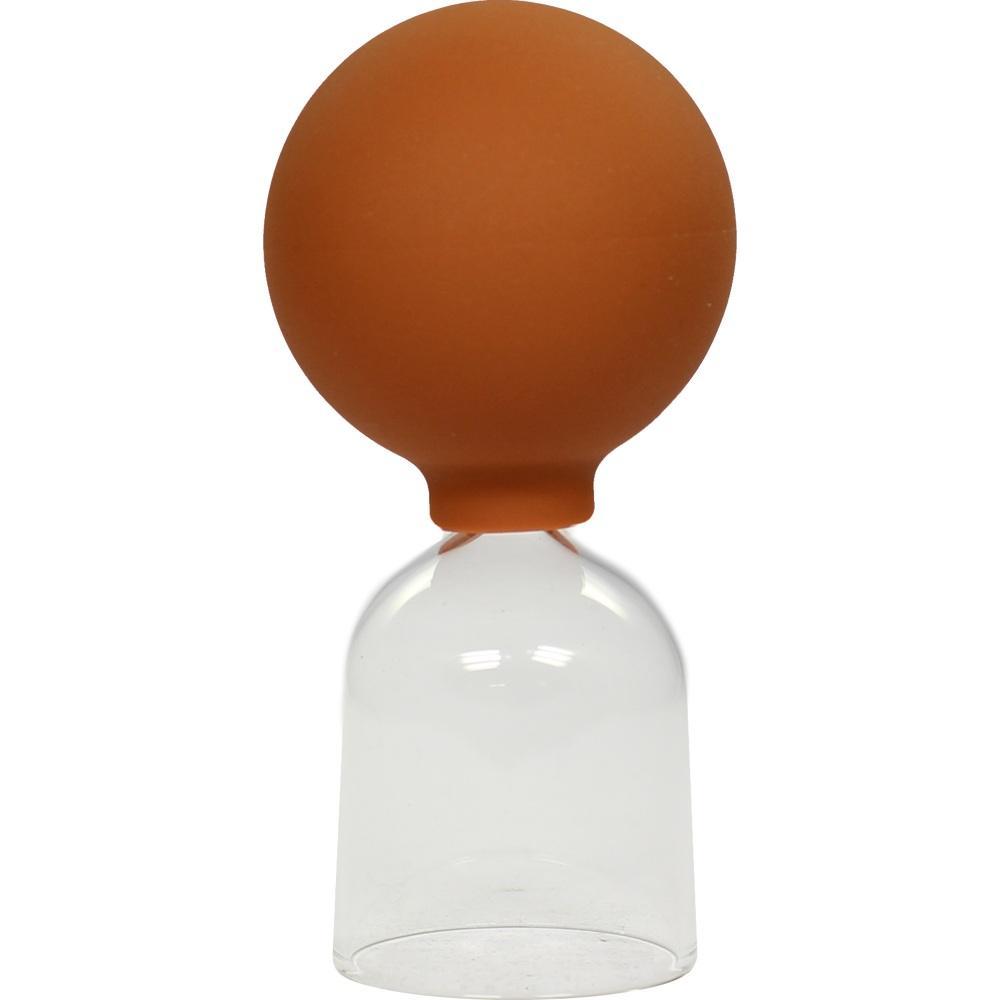 Eine Glasglocke mit einem braunen Gummiballon oben drauf.