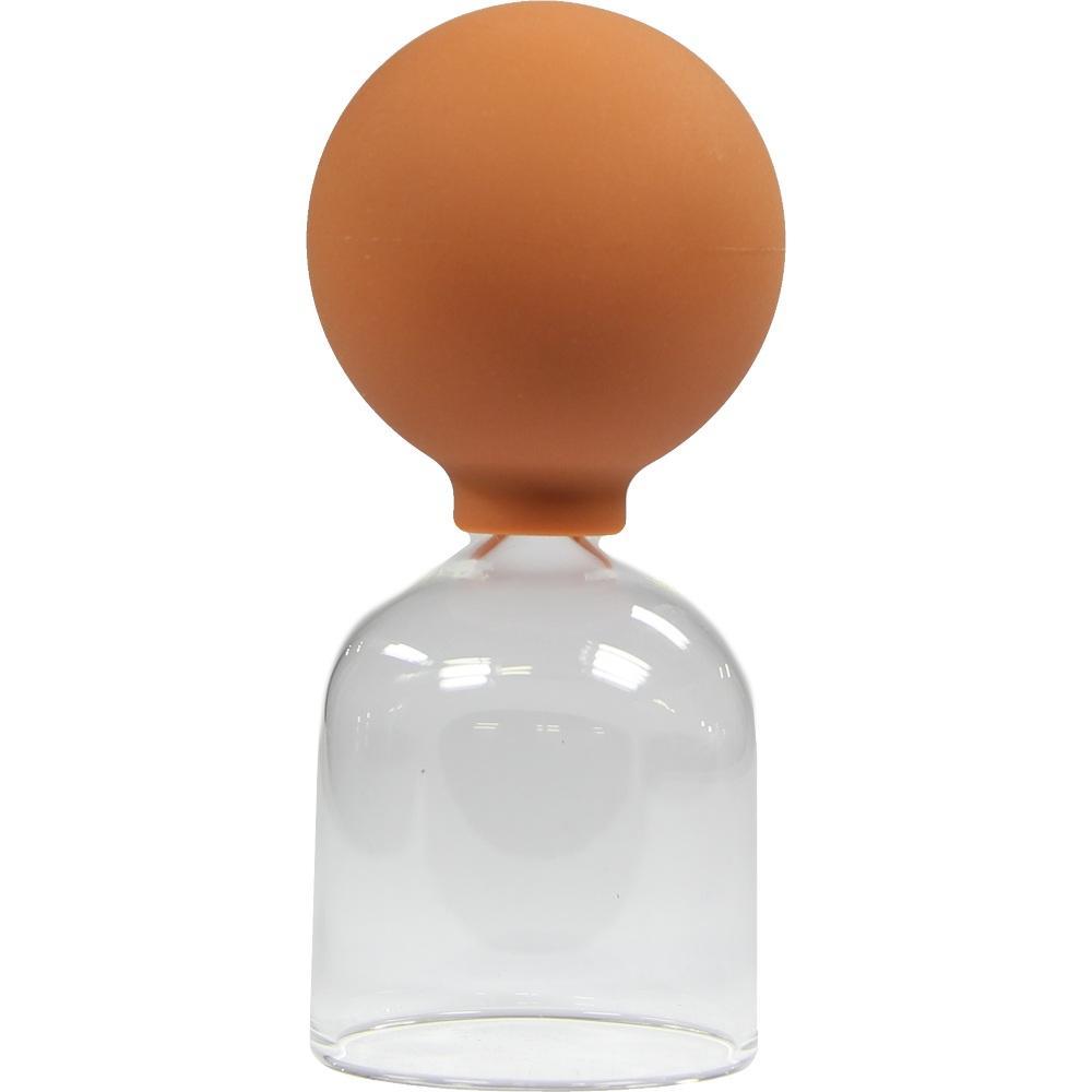 Eine Schröpfglasflasche mit orangem Gummiball oben.