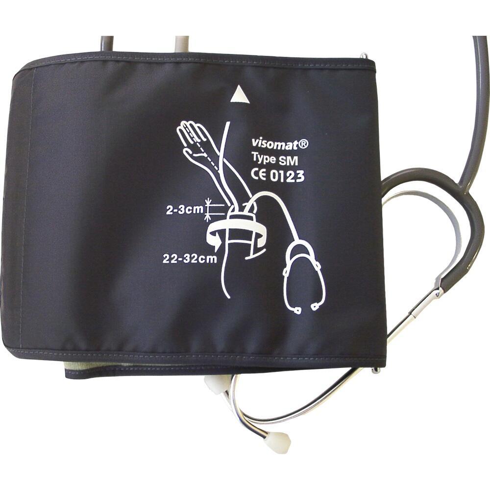 Eine Blutdruckmanschette mit einem Stethoskop liegt auf einem Tisch.