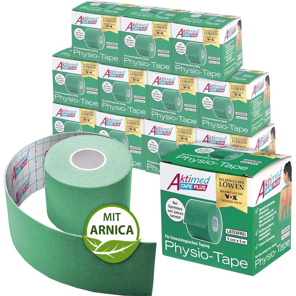Gr&uuml;ne Physio-Tape-Verpackungen und eine Rolle mit "Mit Arnika"-Hinweis auf dem Tisch.