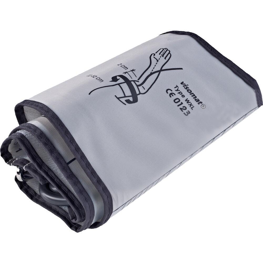 Eine zusammengerollte Blutdruckmanschette liegt auf einem Tisch.