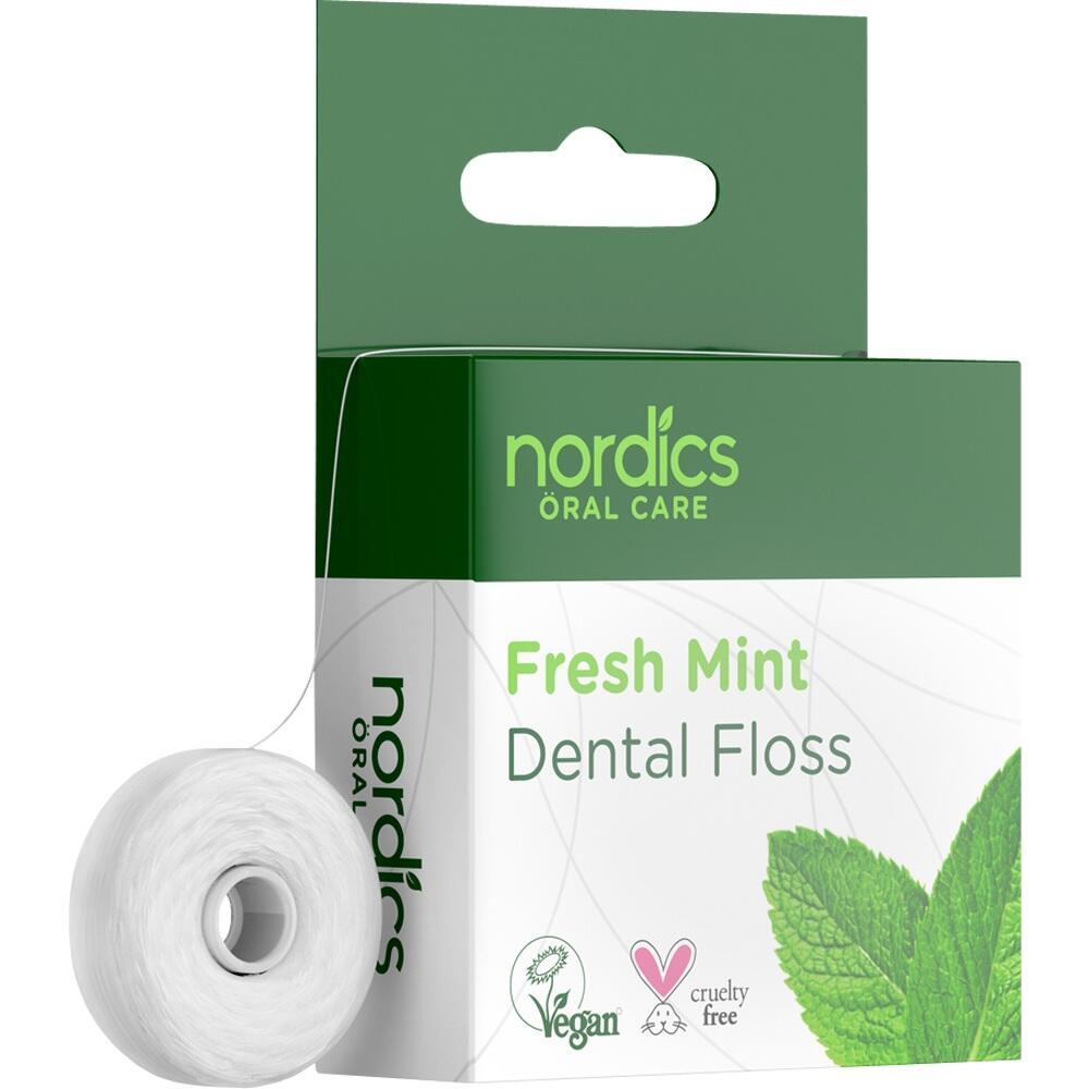 Gr&uuml;ne Verpackung und Zahnseide mit frischem Minzgeschmack.