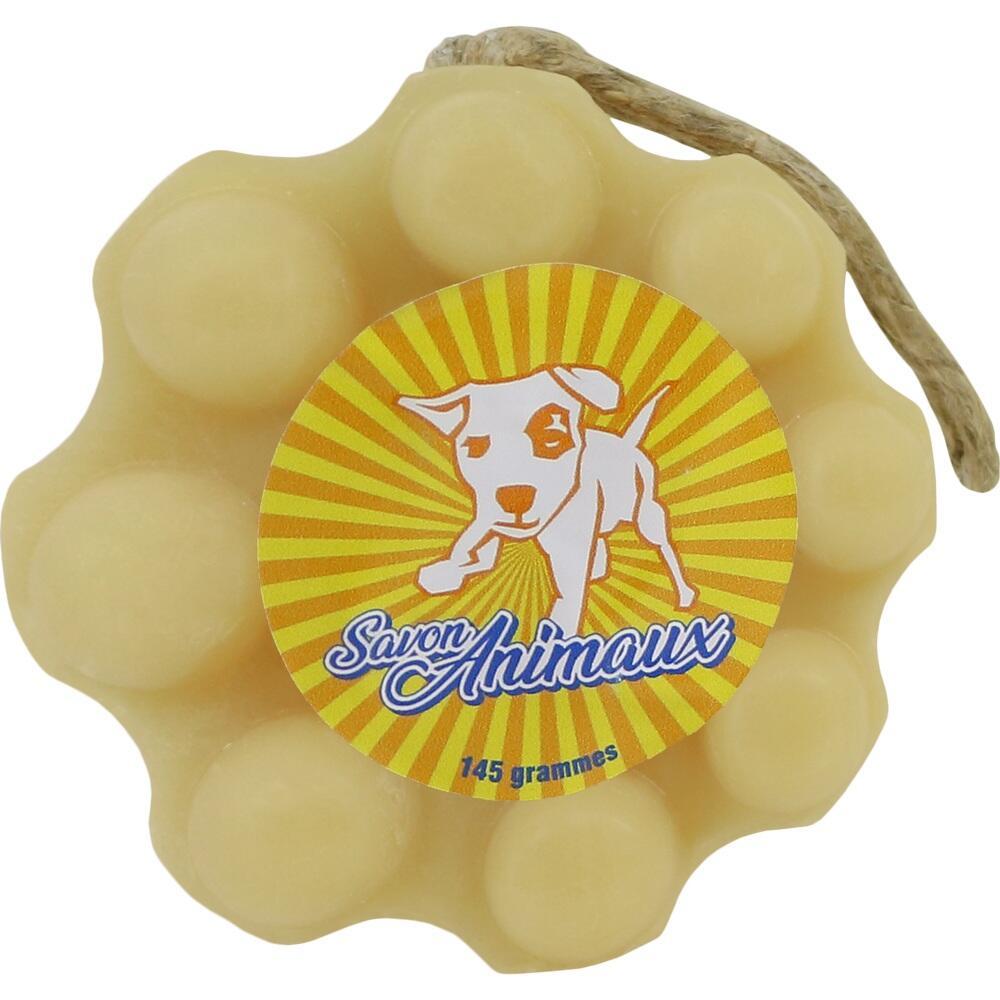 Gelbes Seifenst&uuml;ck mit Hundeaufkleber und einer Kordel zum Aufh&auml;ngen.