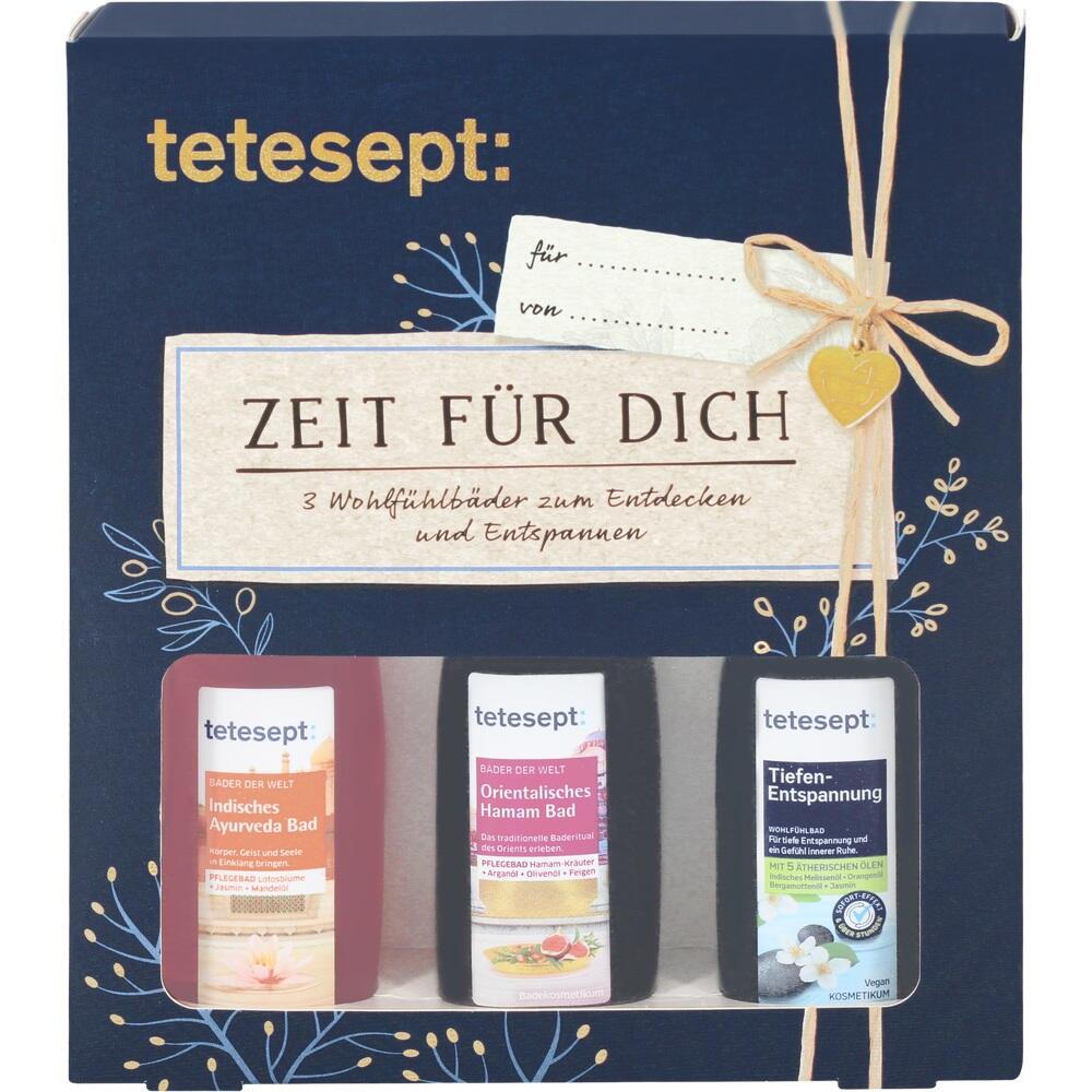 Drei bunte Flaschen Badeschaum in einer dekorativen Geschenkbox.