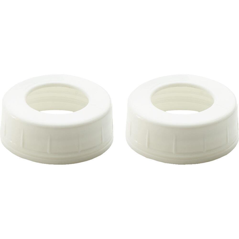 Zwei wei&szlig;e, runde Plastikverschl&uuml;sse mit Loch in der Mitte.