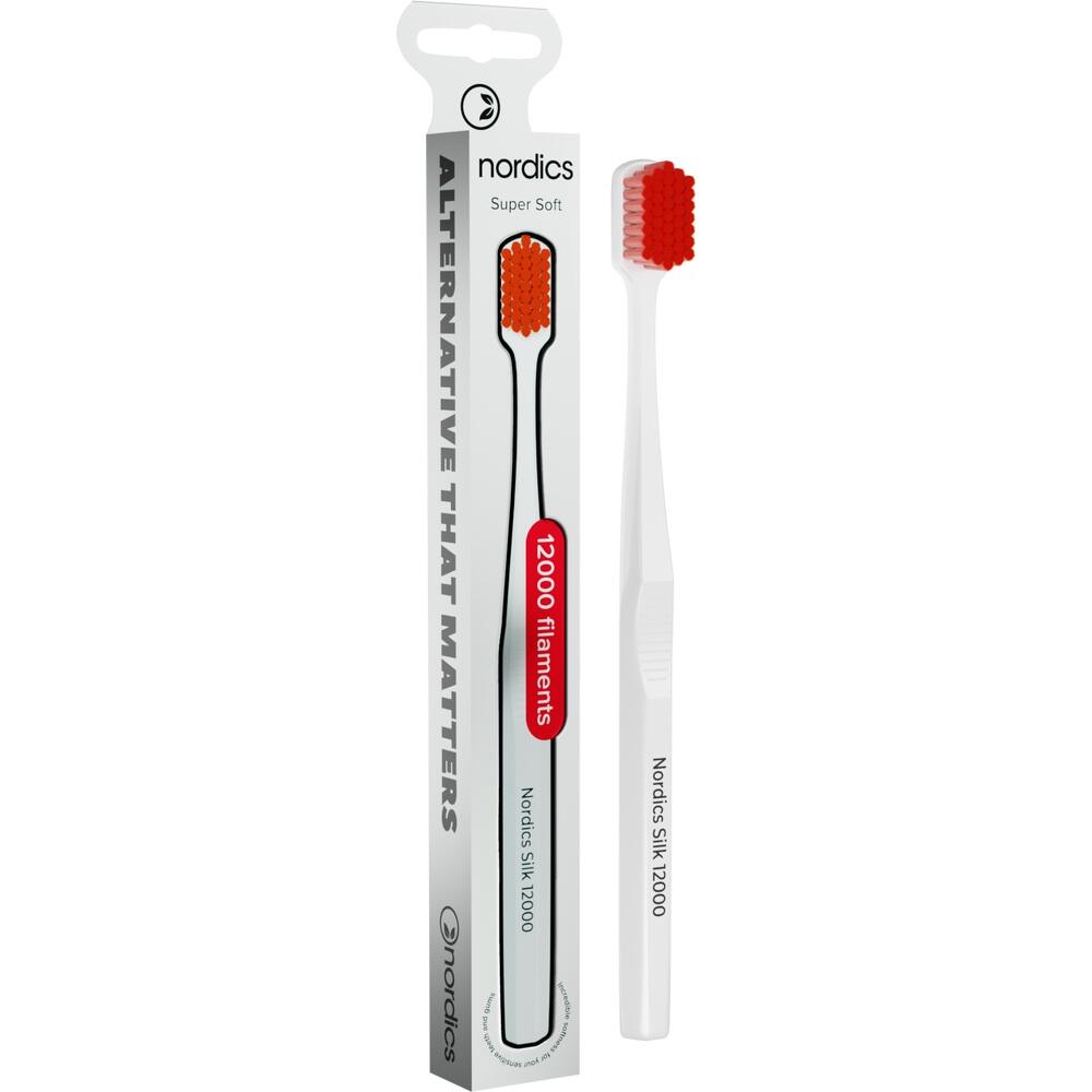 Wei&szlig;e Zahnb&uuml;rste mit roten Borsten neben ihrer Verpackung.