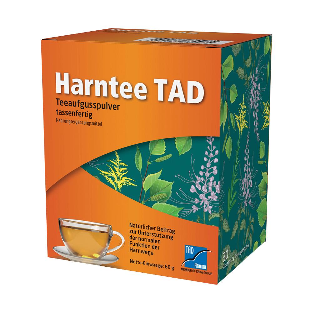 Eine orange Verpackung von Harntee TAD mit Pflanzenmotiv und Teetasse.